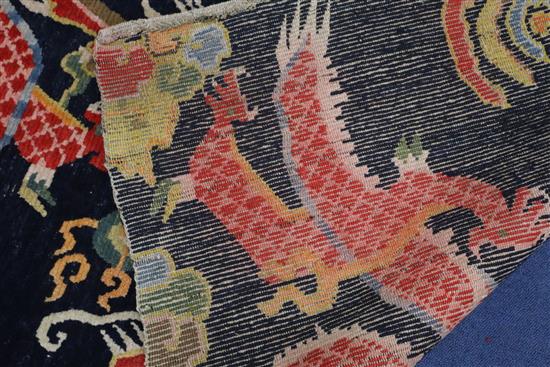 A Tibetan dragon rug, 5ft 6in. x 3ft